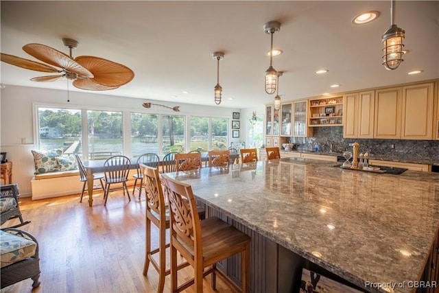 11 Franklin St, Deltaville, VA 23043 - kitchen featuring healthy amount of natural light, a ceiling fan, recessed lighting, a kitchen bar, and open shelves