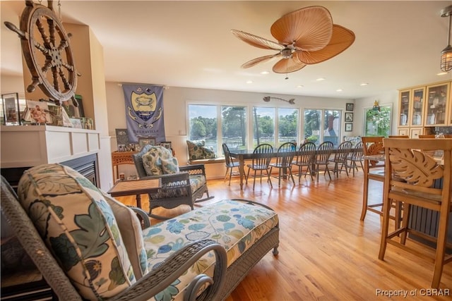 11 Franklin St, Deltaville, VA 23043 - living area with a ceiling fan, wood finished floors, a glass covered fireplace, and recessed lighting