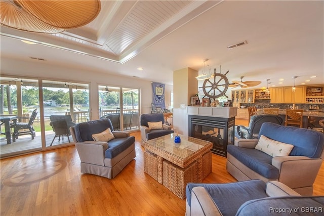 11 Franklin St, Deltaville, VA 23043 - living room with light wood-style flooring, recessed lighting, and a multi sided fireplace