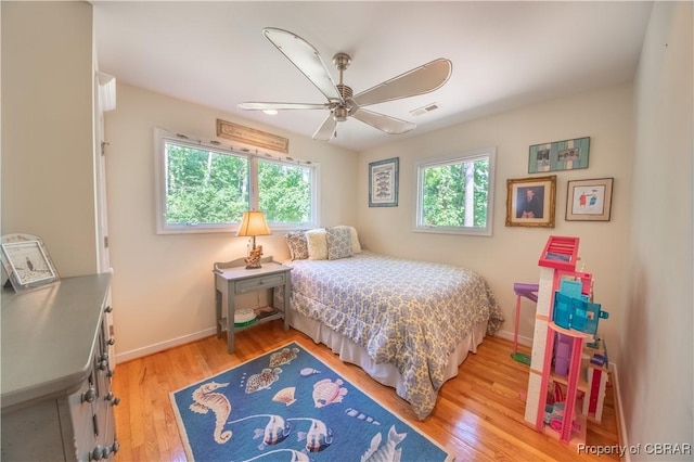 11 Franklin St, Deltaville, VA 23043 - bedroom with light wood finished floors and ceiling fan