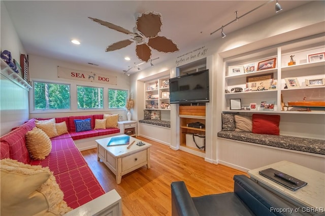 11 Franklin St, Deltaville, VA 23043 - living room featuring light wood-type flooring, ceiling fan, recessed lighting, track lighting, and built in shelves