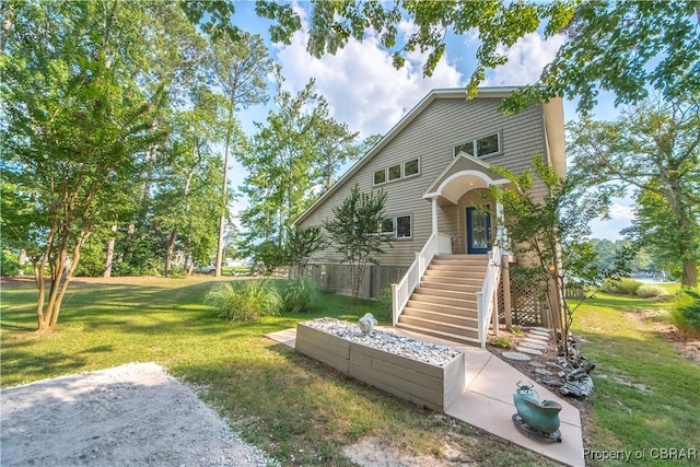 11 Franklin St, Deltaville, VA 23043 - view of front facade with a front yard