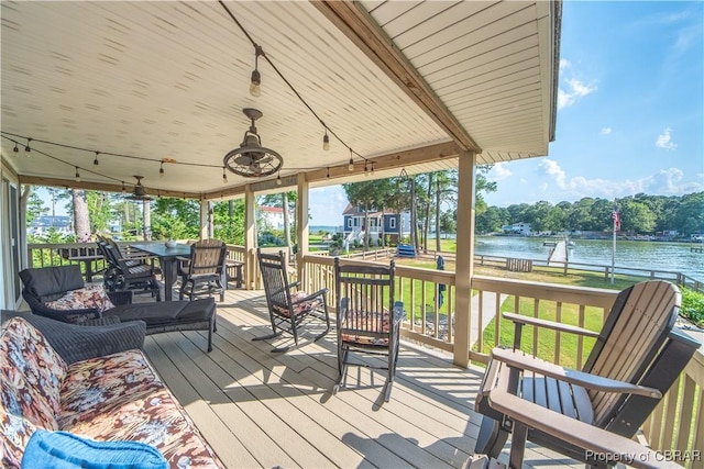 11 Franklin St, Deltaville, VA 23043 - wooden terrace featuring a water view, a ceiling fan, and a lawn