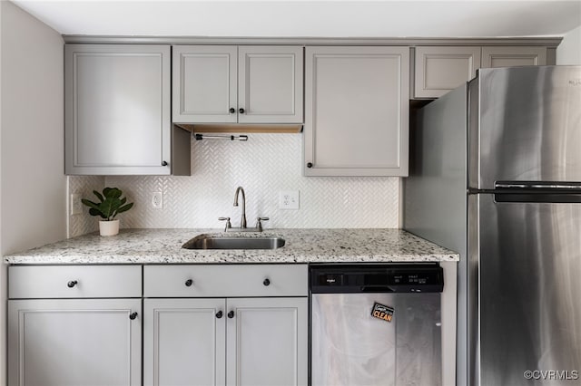 1553 United Ct, Henrico, VA 23238 - kitchen with dishwashing machine, freestanding refrigerator, gray cabinetry, backsplash, and light stone countertops