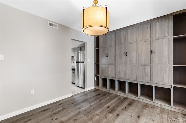 1553 United Ct, Henrico, VA 23238 - unfurnished bedroom with freestanding refrigerator and wood finished floors