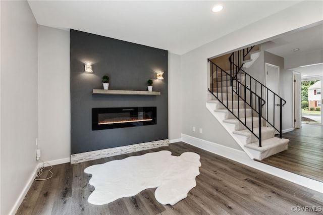 1553 United Ct, Henrico, VA 23238 - living area featuring a glass covered fireplace, wood finished floors, stairway, and recessed lighting