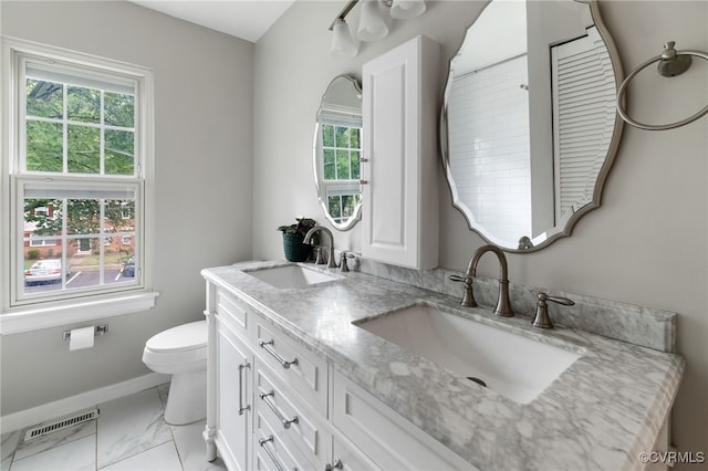 1553 United Ct, Henrico, VA 23238 - bathroom featuring healthy amount of natural light, double vanity, and marble look tile flooring