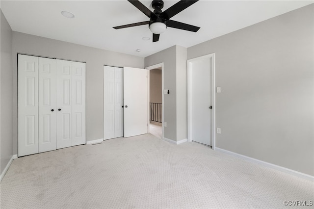 1553 United Ct, Henrico, VA 23238 - unfurnished bedroom with light carpet, two closets, and ceiling fan