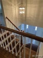 3000 W Riverside Ave, Hopewell, VA 23860 - stairway featuring a chandelier and wood finished floors