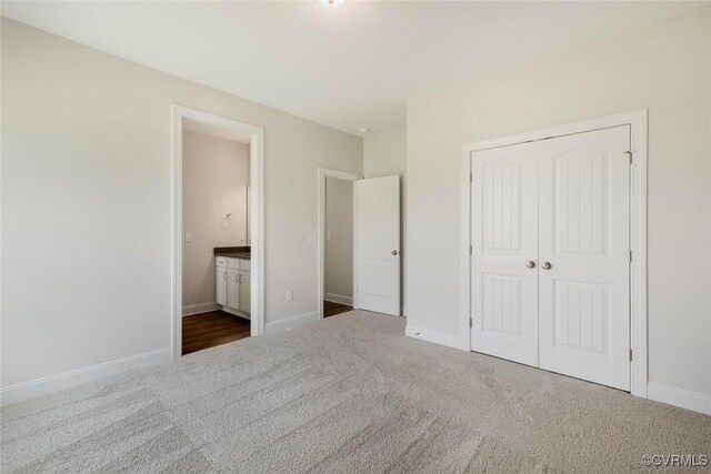 8124 Clancy Ct, Chesterfield, VA 23838 - unfurnished bedroom featuring carpet, a closet, and connected bathroom