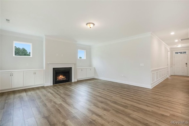 8124 Clancy Ct, Chesterfield, VA 23838 - unfurnished living room with ornamental molding, light wood finished floors, a lit fireplace, and recessed lighting