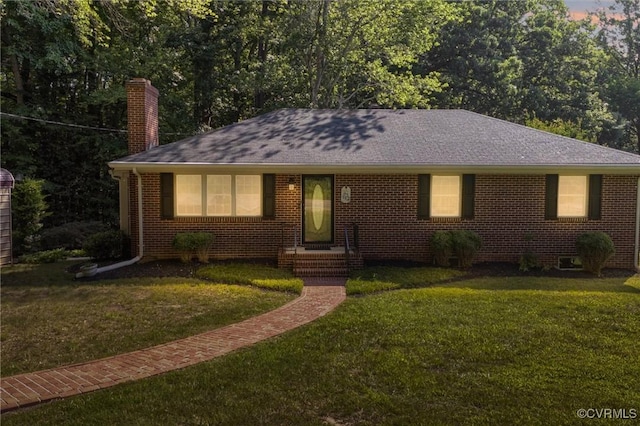 2001 Hicks Rd, North Chesterfield, VA 23235 - view of front of home with a chimney, a front lawn, brick siding, and a shingled roof
