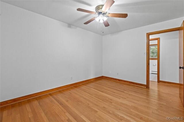 2001 Hicks Rd, North Chesterfield, VA 23235 - spare room featuring light wood-style floors, a baseboard heating unit, and a ceiling fan