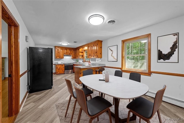 2001 Hicks Rd, North Chesterfield, VA 23235 - dining area featuring light wood-type flooring and baseboards
