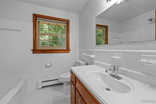 2001 Hicks Rd, North Chesterfield, VA 23235 - bathroom featuring baseboard heating, tile walls, vanity, a bathtub, and tile patterned floors