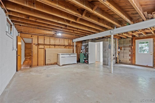 2001 Hicks Rd, North Chesterfield, VA 23235 - basement featuring white fridge, a heating unit, and concrete block wall