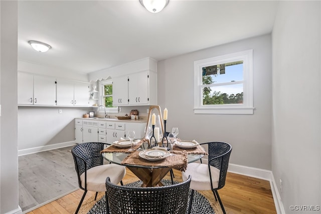 4308 Sunset Dr, North Dinwiddie, VA 23803 - dining room featuring light wood-type flooring and baseboards