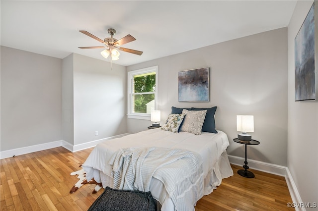 4308 Sunset Dr, North Dinwiddie, VA 23803 - bedroom with light wood finished floors and ceiling fan