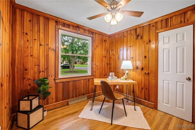4308 Sunset Dr, North Dinwiddie, VA 23803 - office area featuring a baseboard heating unit, ceiling fan, light wood-style flooring, and wooden walls