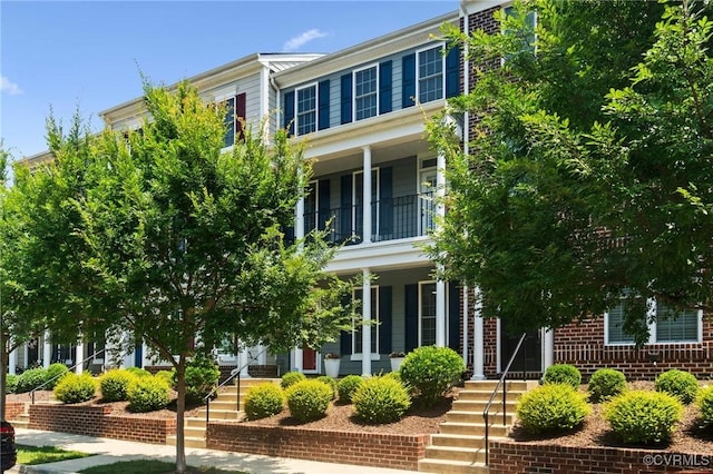 14424 Michaux Village Dr, Midlothian, VA 23113 - view of front of home with a balcony, covered porch, and stairway