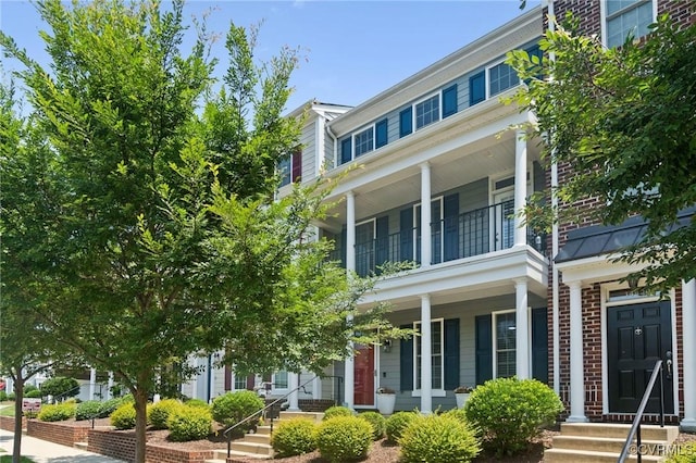 14424 Michaux Village Dr, Midlothian, VA 23113 - view of front of property featuring a balcony, covered porch, and brick siding