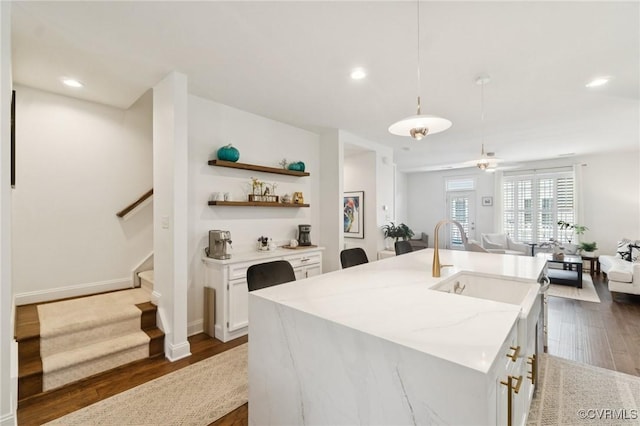 14424 Michaux Village Dr, Midlothian, VA 23113 - kitchen featuring open floor plan, dark wood-type flooring, white cabinetry, pendant lighting, and light stone counters
