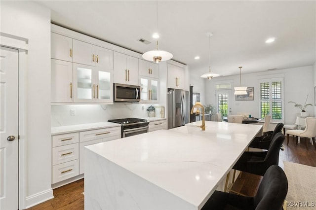 14424 Michaux Village Dr, Midlothian, VA 23113 - kitchen with stainless steel appliances, white cabinets, dark wood-style flooring, and recessed lighting