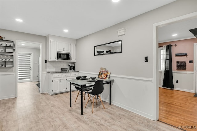 14210 Cherry St, Chester, VA 23831 - kitchen with black microwave, light wood-type flooring, white cabinets, plenty of natural light, and recessed lighting