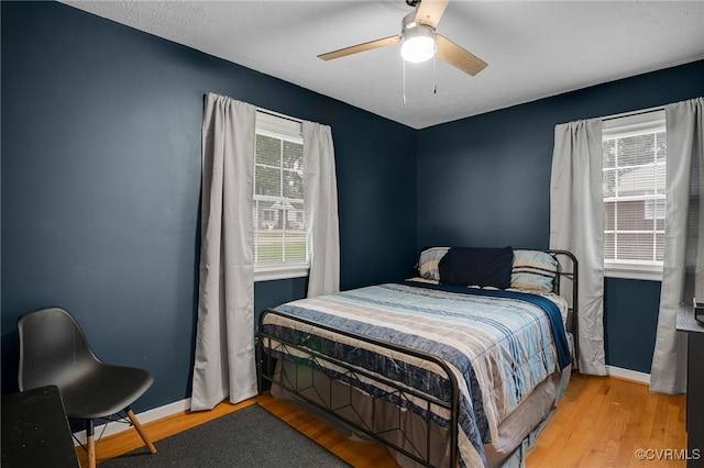 14210 Cherry St, Chester, VA 23831 - bedroom with wood finished floors and a ceiling fan