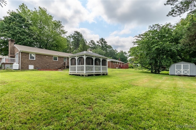 14210 Cherry St, Chester, VA 23831 - view of grassy yard with a storage shed, a deck, and a gazebo