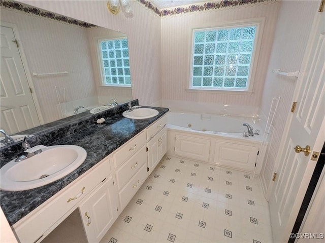 12703 Colby Cove Ct, Chester, VA 23831 - bathroom with a tub with jets, double vanity, and tile patterned flooring