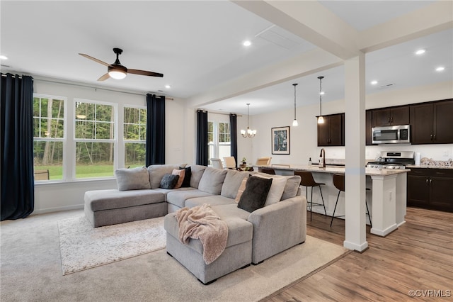 18325 Palisades Ct, Moseley, VA 23120 - living area featuring a chandelier, ceiling fan, recessed lighting, and light wood-type flooring