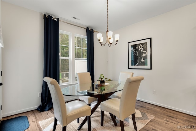 18325 Palisades Ct, Moseley, VA 23120 - dining space featuring a chandelier and light wood-type flooring