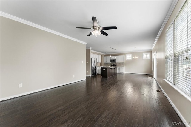 17412 Trevino Pkwy, Moseley, VA 23120 - unfurnished living room with ceiling fan, a chandelier, dark wood finished floors, and crown molding