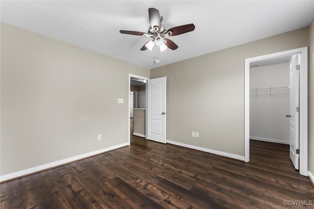 17412 Trevino Pkwy, Moseley, VA 23120 - unfurnished bedroom with a spacious closet, dark wood-style floors, and ceiling fan