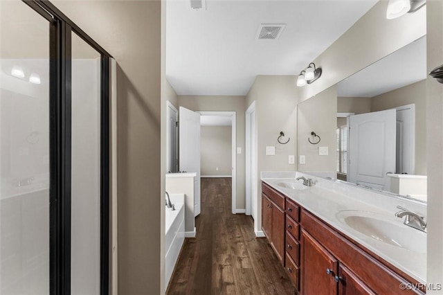17412 Trevino Pkwy, Moseley, VA 23120 - bathroom with a bath, wood finished floors, and double vanity