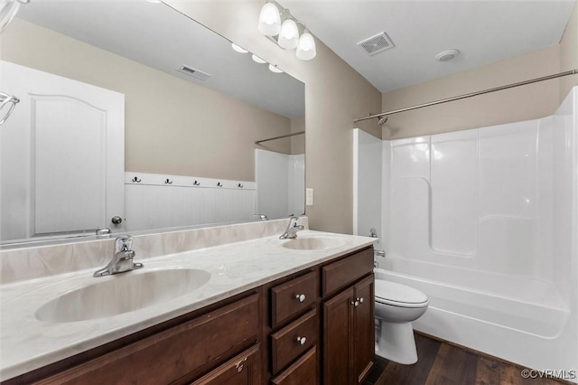 17412 Trevino Pkwy, Moseley, VA 23120 - full bathroom featuring double vanity, shower / bath combination, and wood finished floors