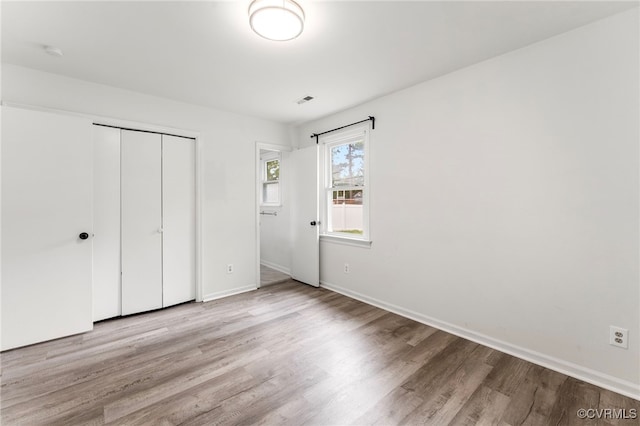 10500 Claybar Trl, North Chesterfield, VA 23236 - unfurnished bedroom with wood finished floors and a closet