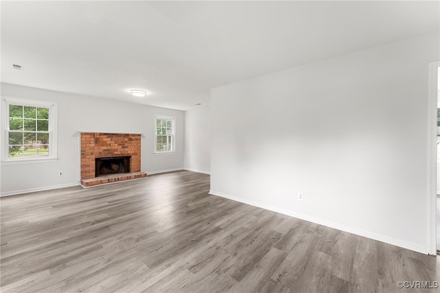 10500 Claybar Trl, North Chesterfield, VA 23236 - unfurnished living room with plenty of natural light, wood finished floors, and a fireplace