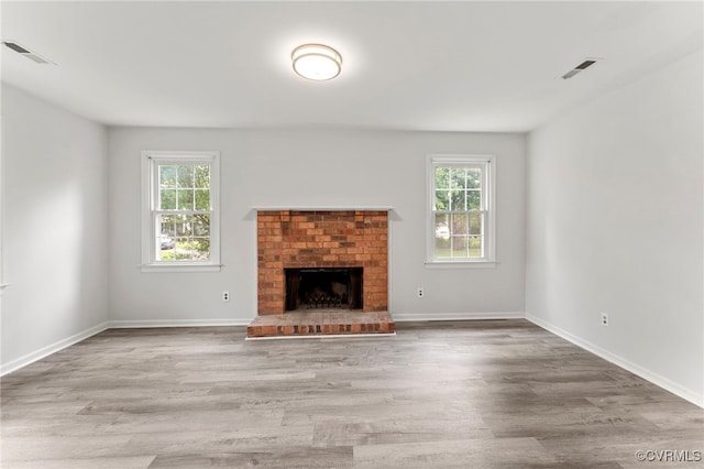 10500 Claybar Trl, North Chesterfield, VA 23236 - unfurnished living room with healthy amount of natural light, wood finished floors, and a fireplace