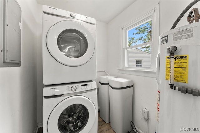 10500 Claybar Trl, North Chesterfield, VA 23236 - laundry area featuring stacked washer / dryer, electric water heater, electric panel, and wood finished floors