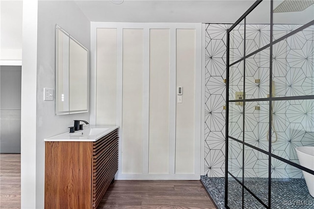 113 Rappa Run Rd, Topping, VA 23169 - full bath featuring wood finished floors, vanity, and a shower