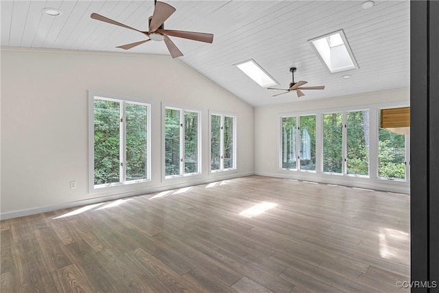 113 Rappa Run Rd, Topping, VA 23169 - empty room with a skylight, ceiling fan, plenty of natural light, vaulted ceiling, and wood finished floors