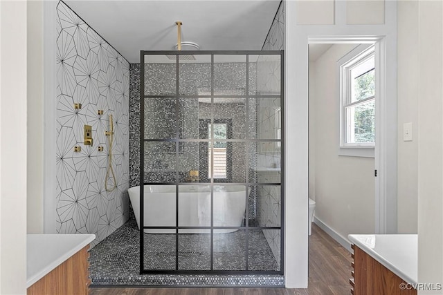 113 Rappa Run Rd, Topping, VA 23169 - full bathroom featuring vanity, a freestanding bath, wood finished floors, and a shower stall