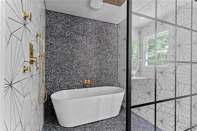 113 Rappa Run Rd, Topping, VA 23169 - full bathroom featuring tile walls and a soaking tub