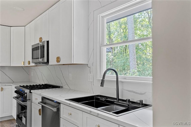 113 Rappa Run Rd, Topping, VA 23169 - kitchen with appliances with stainless steel finishes, plenty of natural light, and white cabinetry