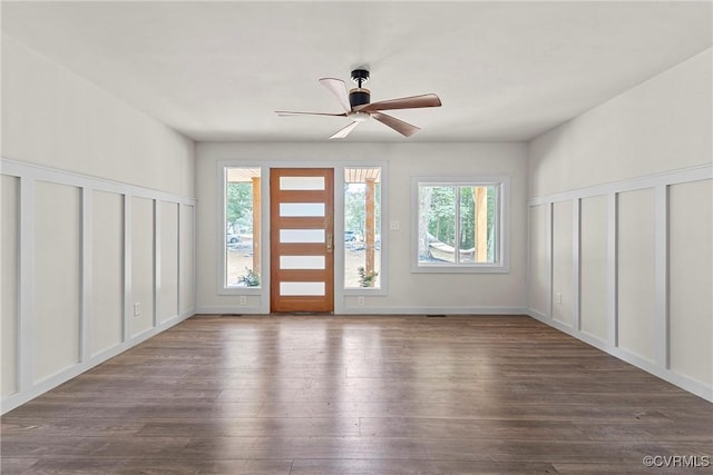 113 Rappa Run Rd, Topping, VA 23169 - entryway featuring dark wood finished floors, a ceiling fan, and a decorative wall