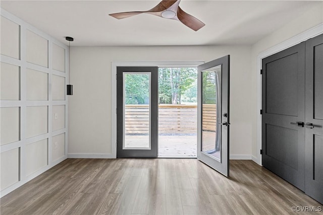 113 Rappa Run Rd, Topping, VA 23169 - unfurnished bedroom featuring access to exterior, light wood-style flooring, and a ceiling fan