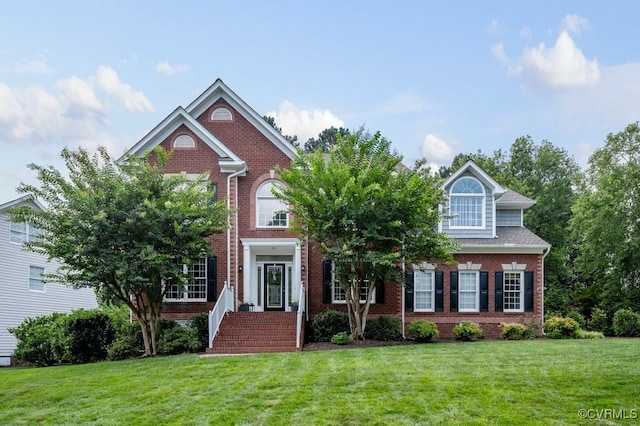 15585 Fox Cove Cir, Moseley, VA 23120 - view of front facade featuring a front lawn and brick siding