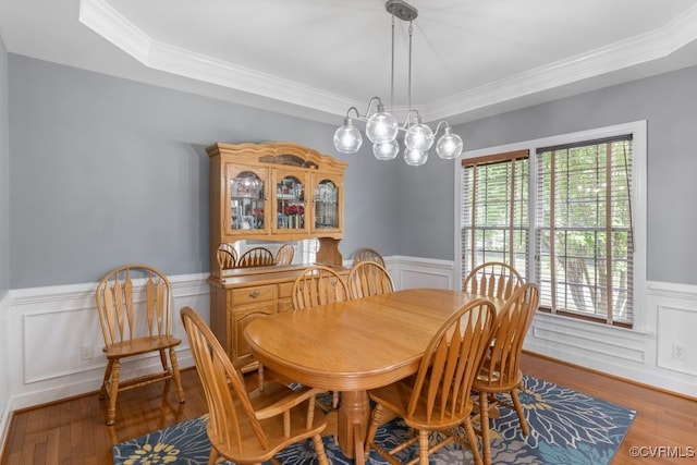 15585 Fox Cove Cir, Moseley, VA 23120 - dining room featuring wainscoting, wood finished floors, crown molding, and a decorative wall
